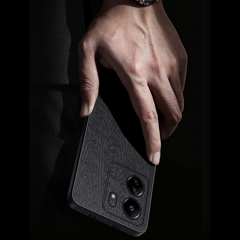 For Xiaomi Redmi 13C 4G / Poco C65 4G Wood Texture PU Leather Coated PC+TPU Cell Phone Case - Black