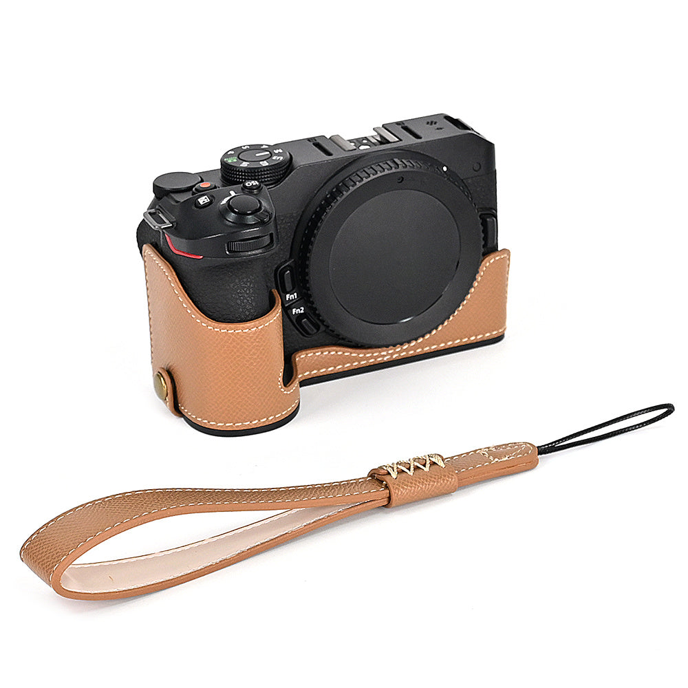 For Nikon Z30 / Z50 Battery Opening Design PU Leather Camera Cover Palm Texture Half Body Bottom Case with Wrist Strap
