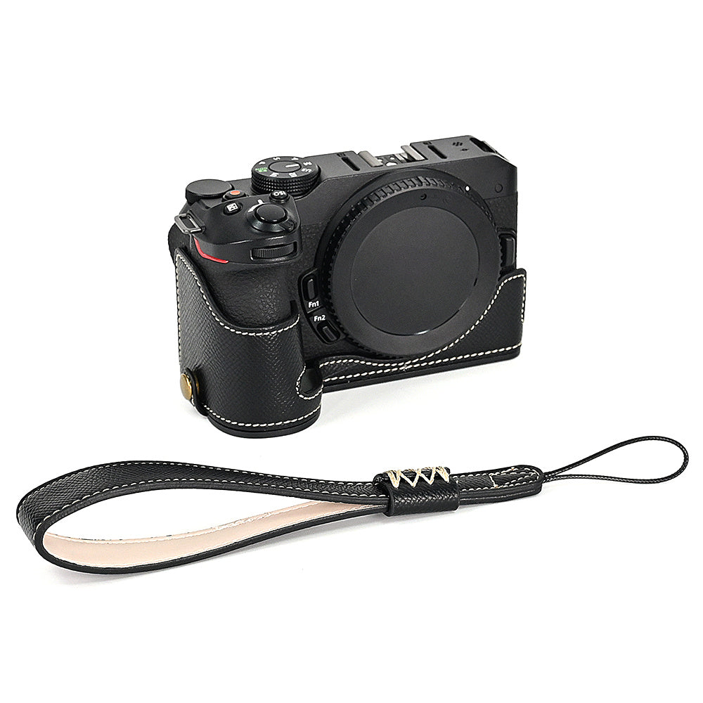 For Nikon Z30 / Z50 Battery Opening Design PU Leather Camera Cover Palm Texture Half Body Bottom Case with Wrist Strap