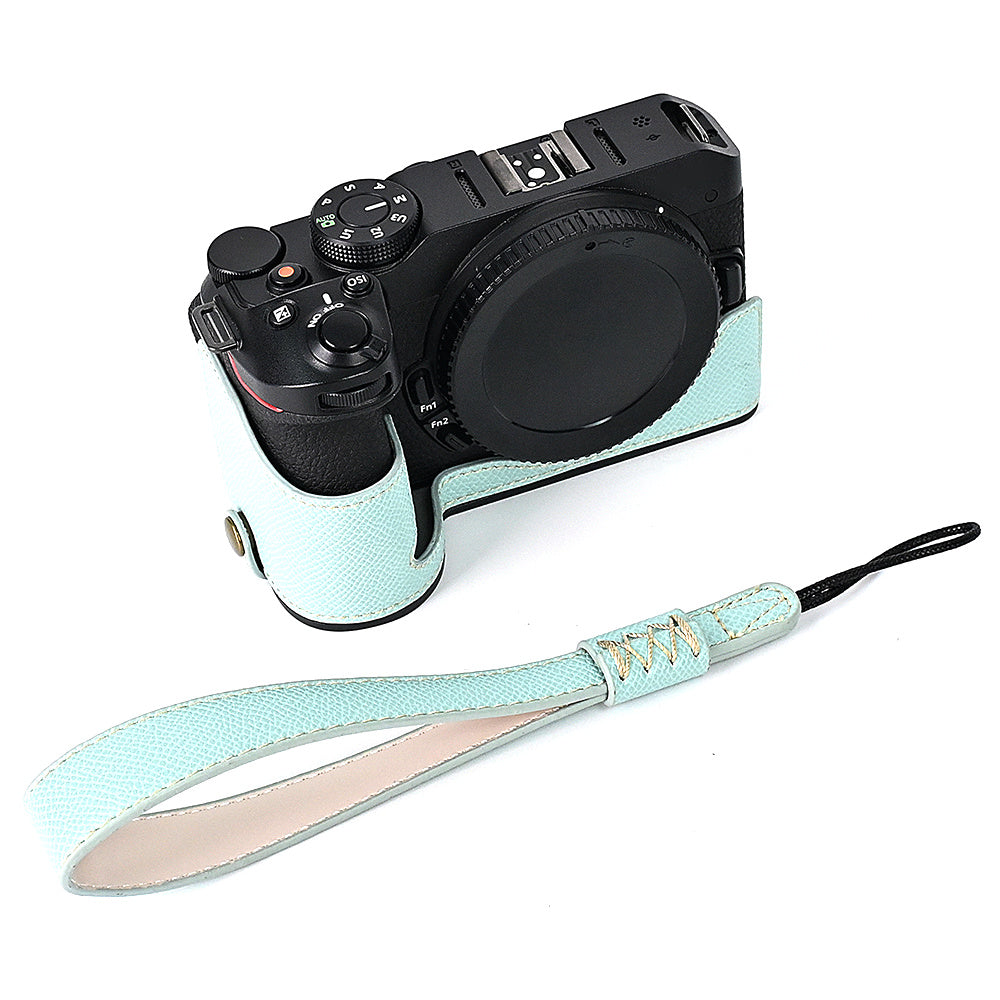 For Nikon Z30 / Z50 Battery Opening Design PU Leather Camera Cover Palm Texture Half Body Bottom Case with Wrist Strap