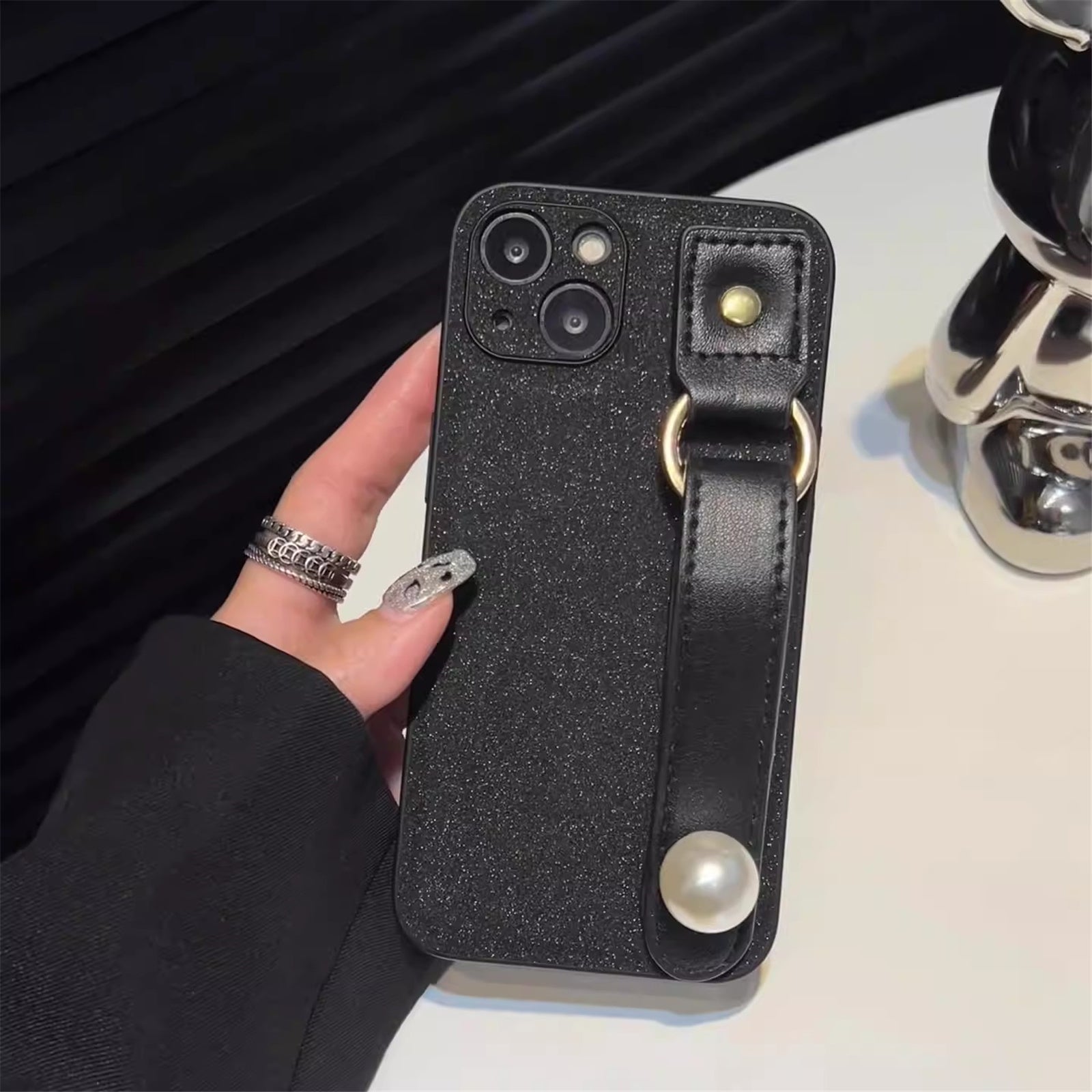For iPhone 14 Dustproof Phone Case Pearl Decor Wristband Black PU Leather TPU Phone Cover Shell