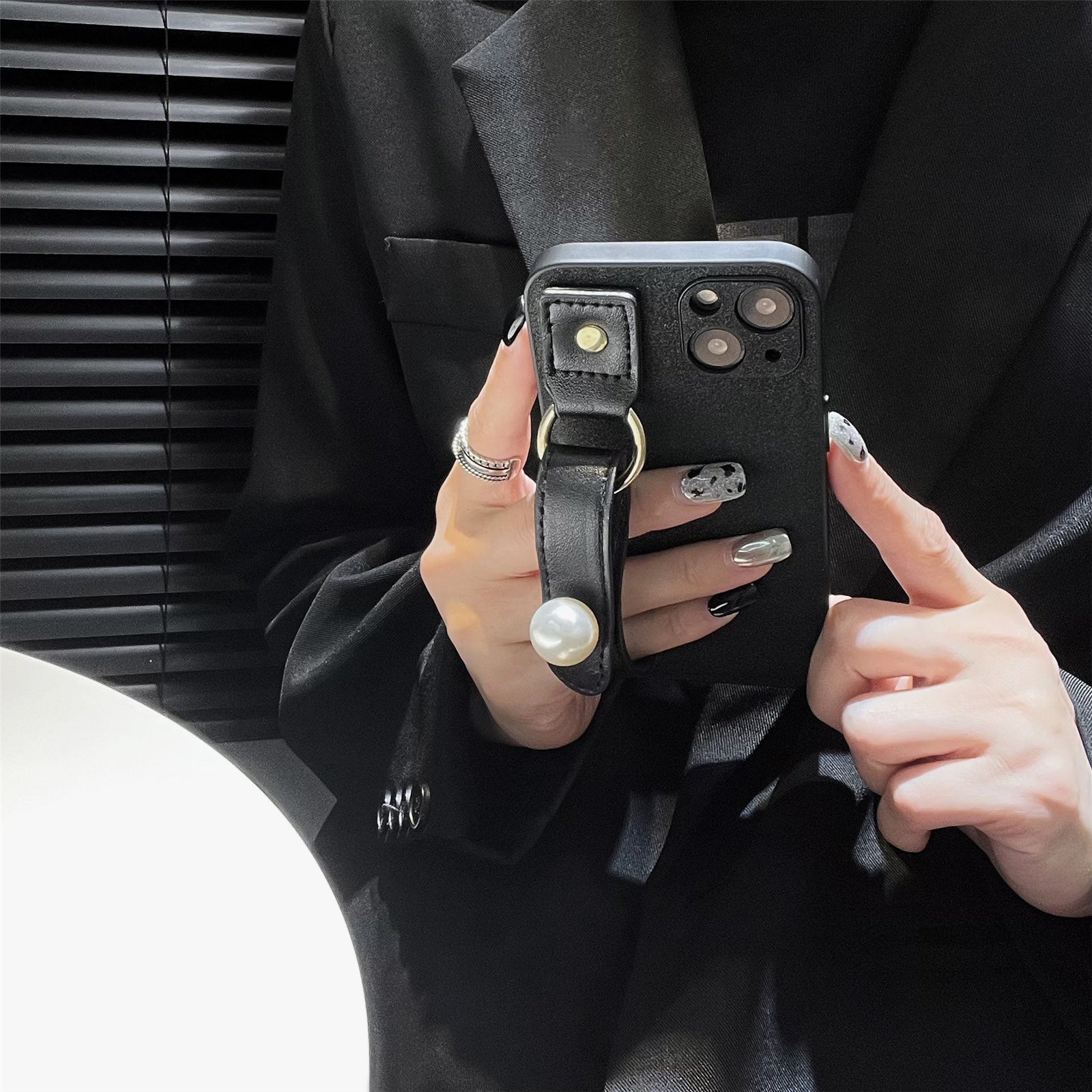 For iPhone 14 Dustproof Phone Case Pearl Decor Wristband Black PU Leather TPU Phone Cover Shell